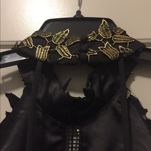 Size 8 black and gold halter dress.